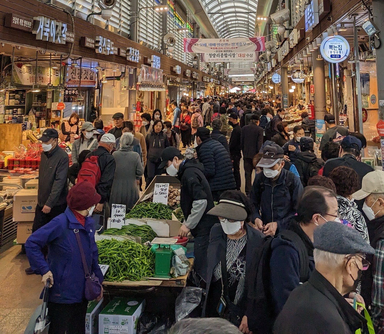 Shoppers in a crowded covered Seoul market