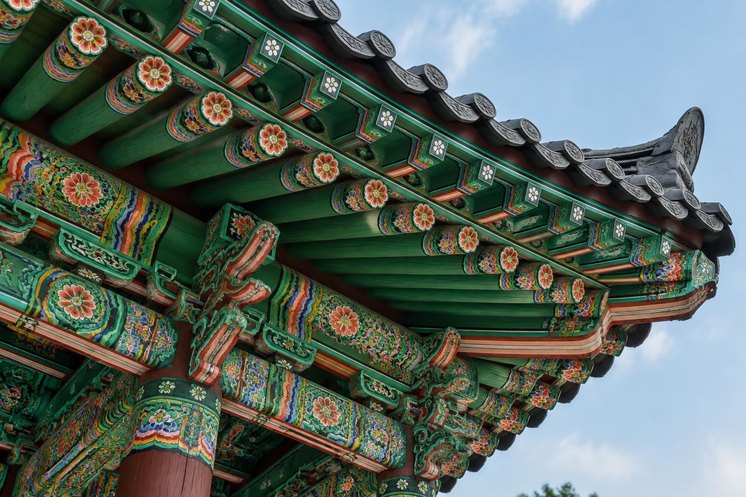 Floral painted timber under Korean temple eaves